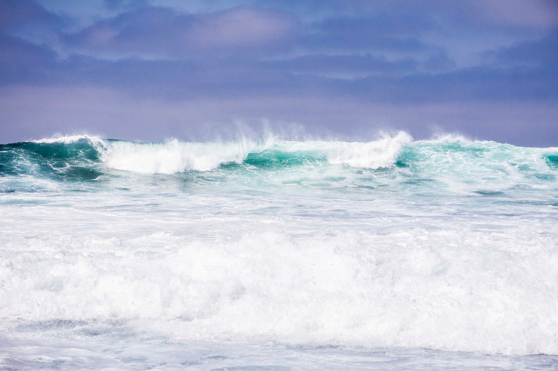 body of water under purple and blue sky illustration